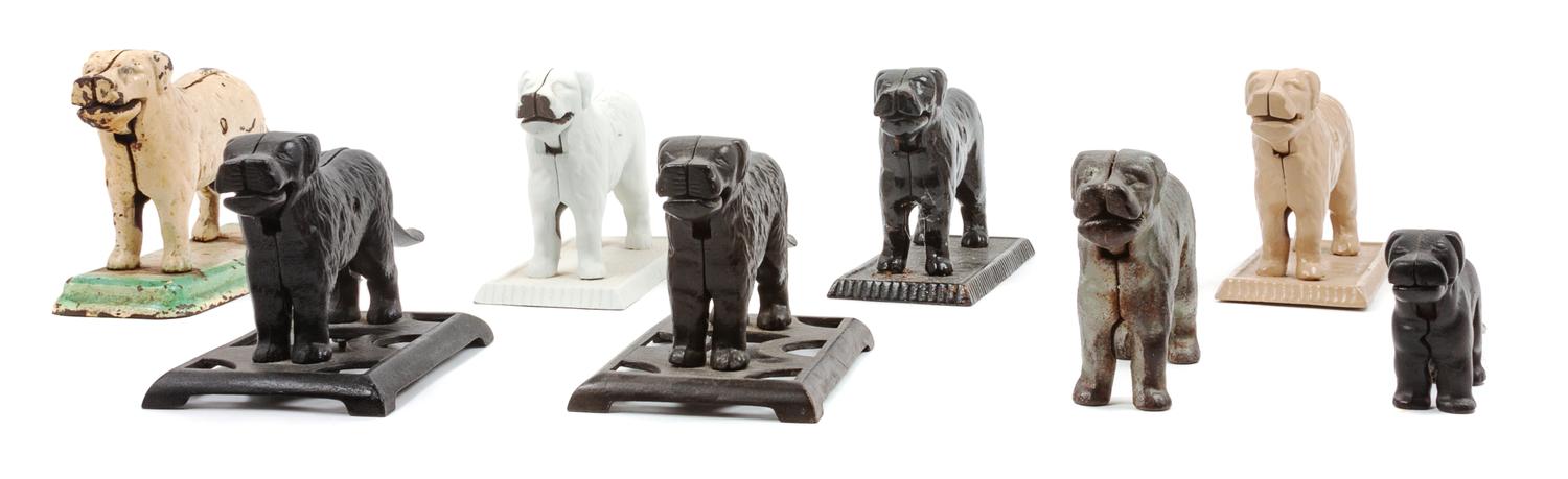 A Group of Eight Great Pyrenees Nutcrackers Width of widest 13 inches.