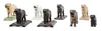 A Group of Eight Great Pyrenees Nutcrackers Width of widest 13 inches.