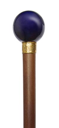 A French Porcelain Handled Walking Stick, Diameter of handle 1 3/4 x length overall 34 5/8 inches.
