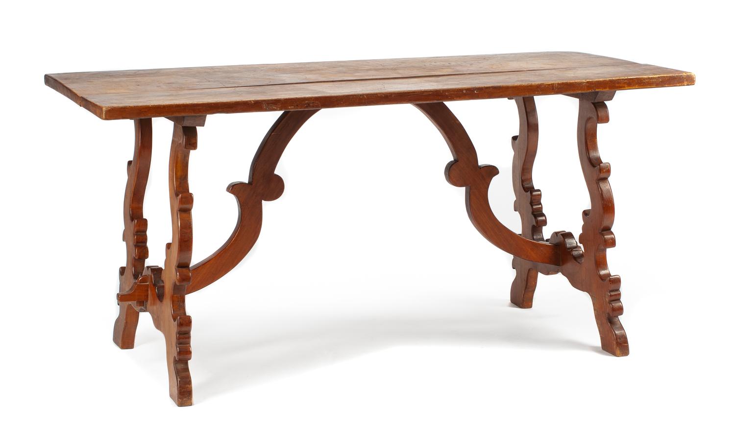 A Spanish Renaissance Style Walnut Trestle Table Height 30 1/2 x width 65 x depth 29 1/2 inches.