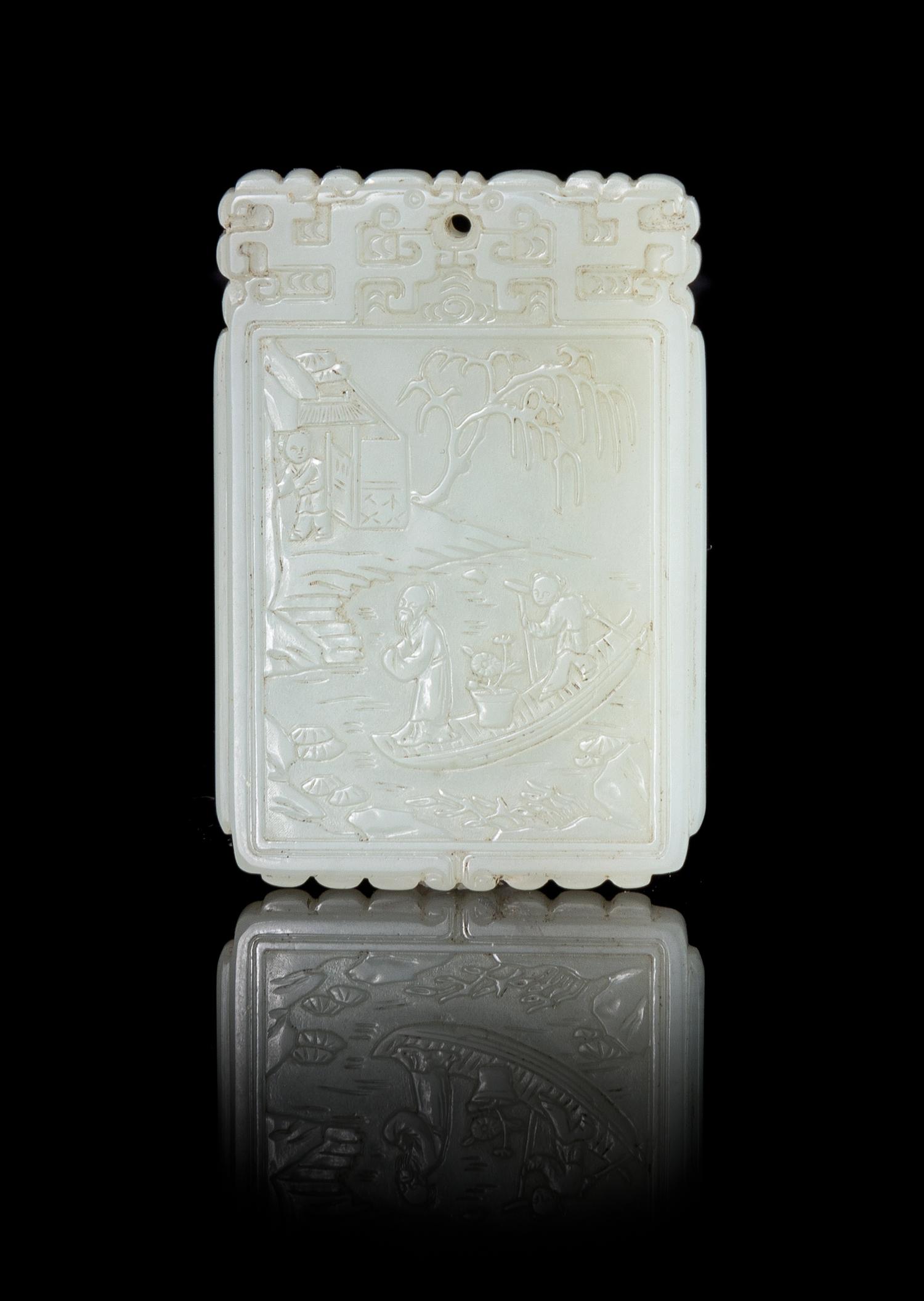 A White Jade Pendant Height 2 1/2 x width 1 1/2 inches.