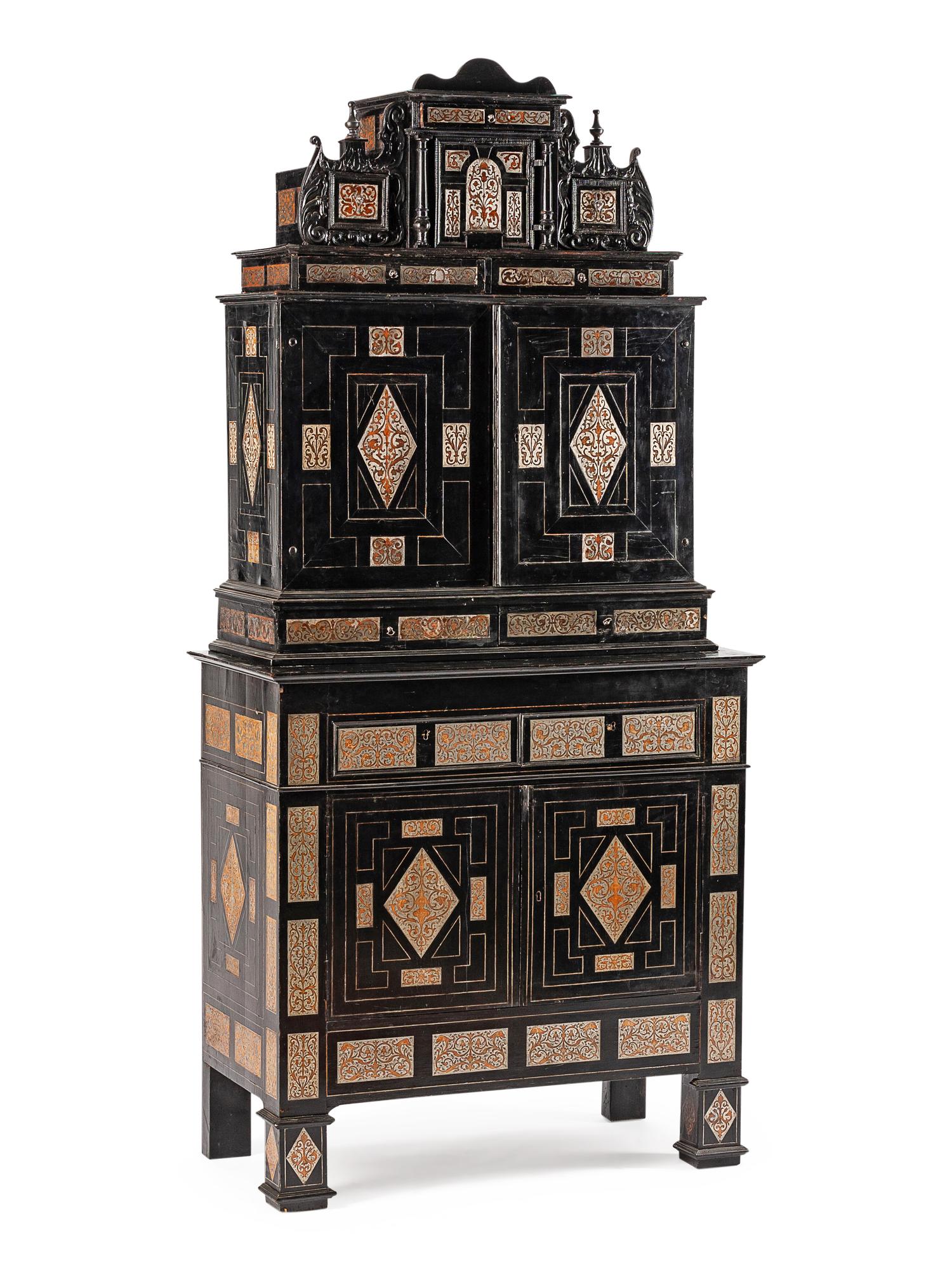 A Continental Pewter Inlaid and Ebonized Cabinet