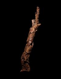 A Chinese Chenxiang Wood 'Squirrel and Grapes' Carving