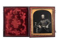 [EARLY PHOTOGRAPHY - MILITARY]. Sixth plate ambrotype portrait of a British regular army officer with shako and sword.