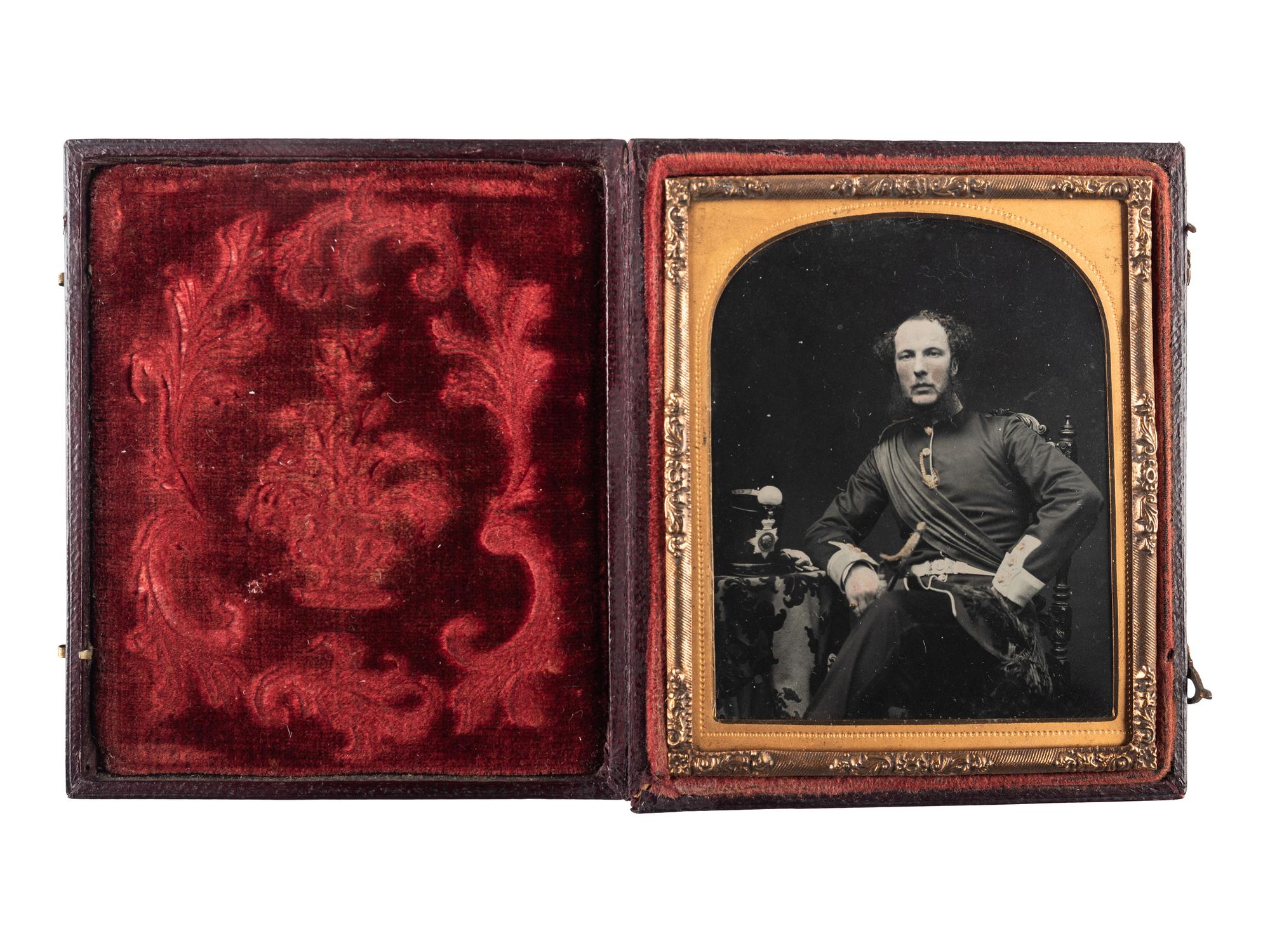 [EARLY PHOTOGRAPHY - MILITARY]. Sixth plate ambrotype portrait of a British regular army officer with shako and sword.
