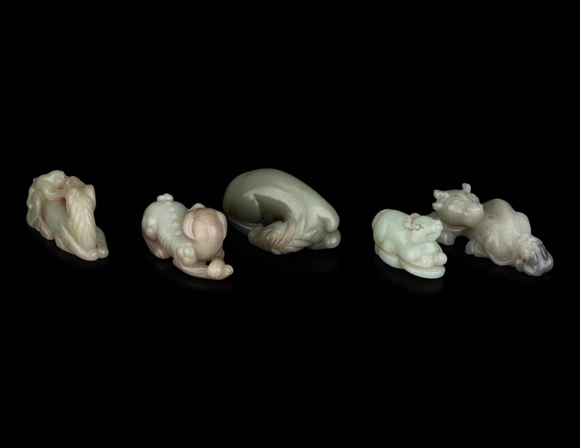 Five Chinese Carved Celadon Jade Figures of Recumbent Animals