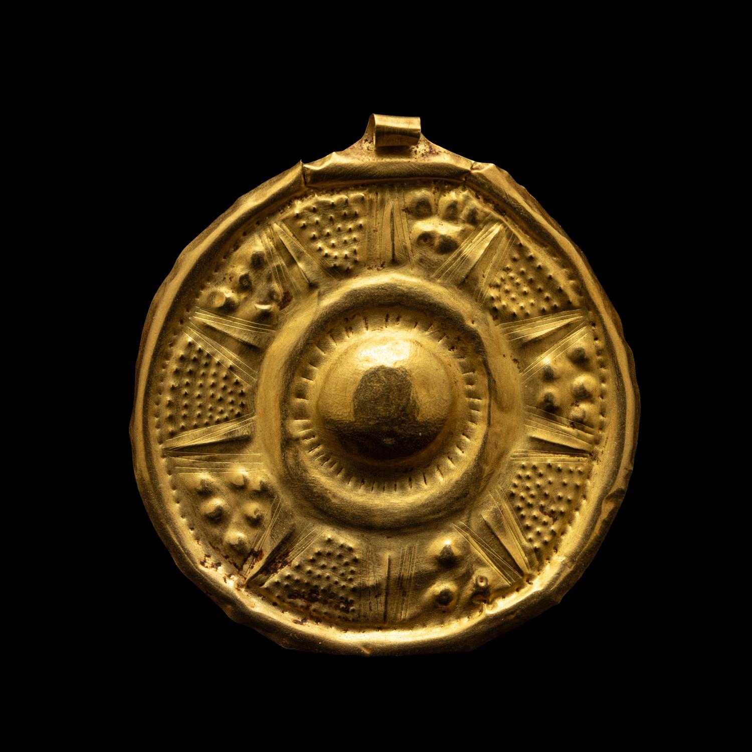 A Near Eastern Gold Disk Pendant