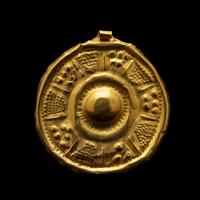A Near Eastern Gold Disk Pendant