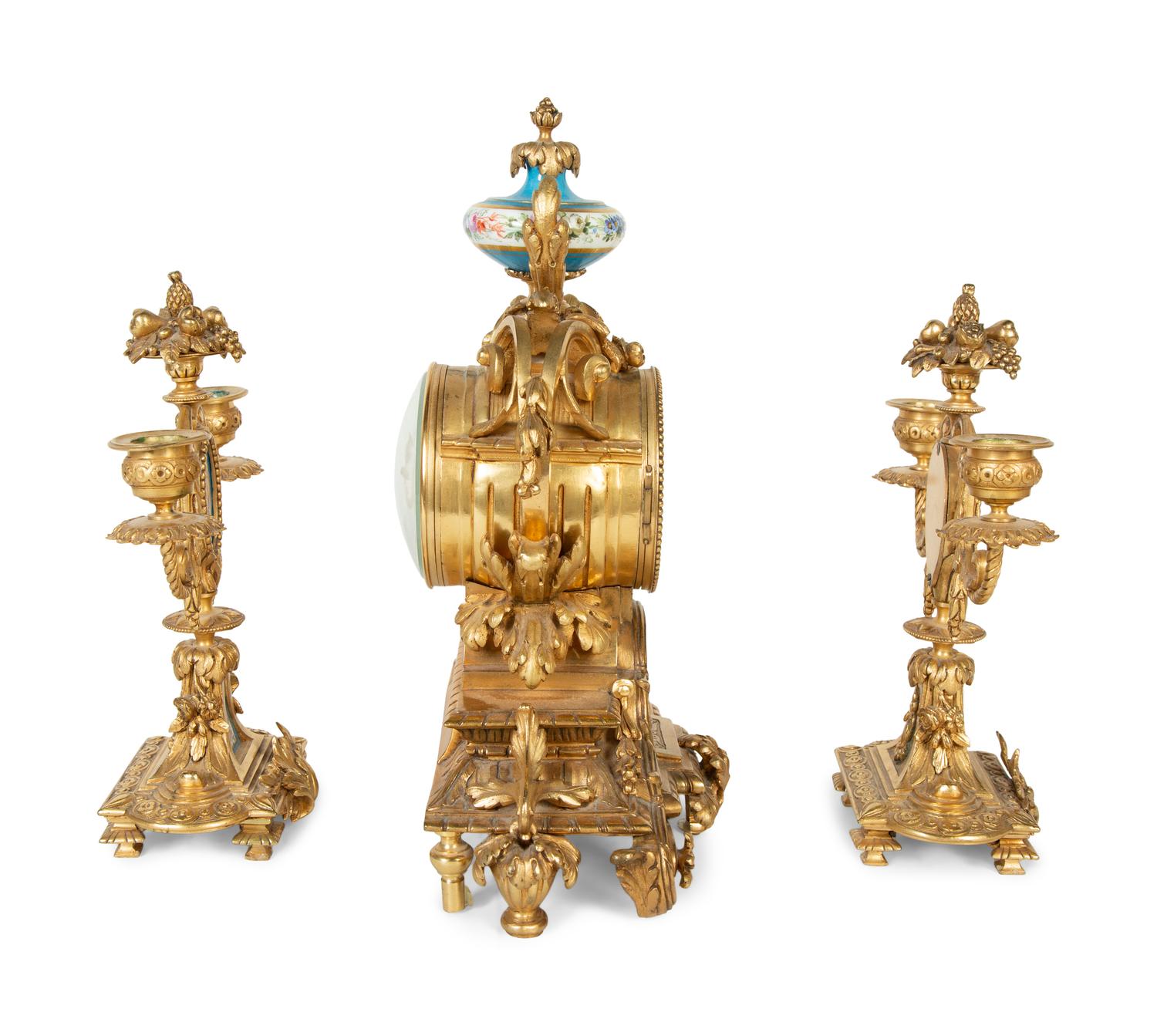 A French Gilt Bronze and Sèvres Porcelain Clock Garniture