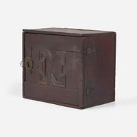 A Charles I carved oak wall-hanging spice cupboard circa 1650