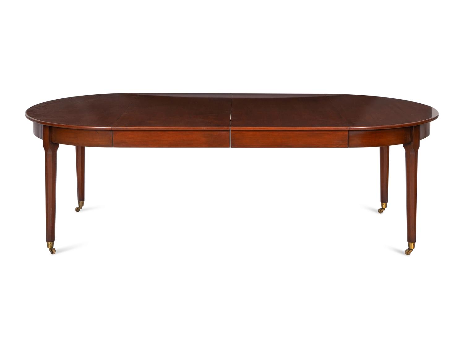 A Mahogany Dining Table and An Associated Set of Eight Mahogany Chairs