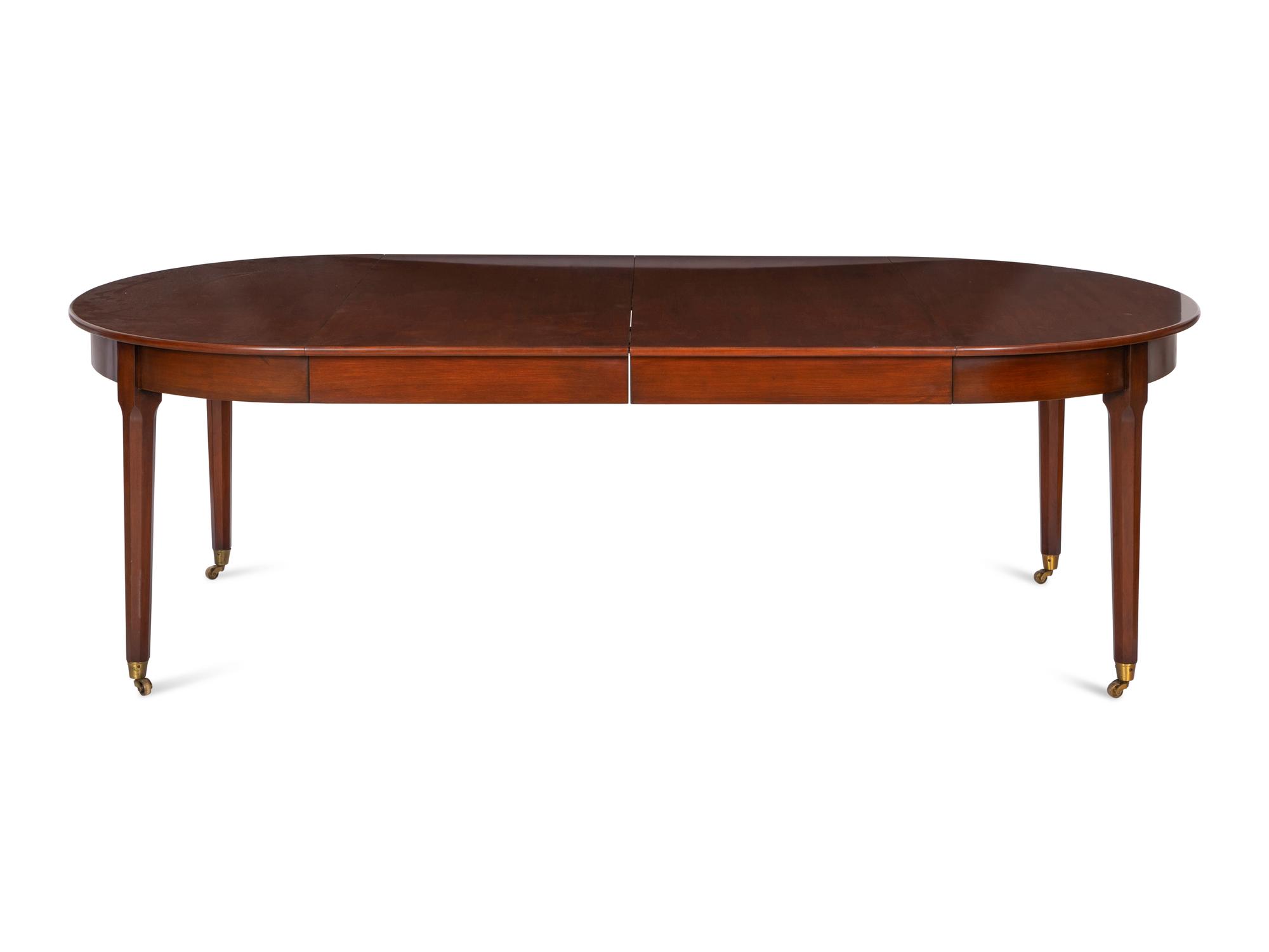 A Mahogany Dining Table and An Associated Set of Eight Mahogany Chairs