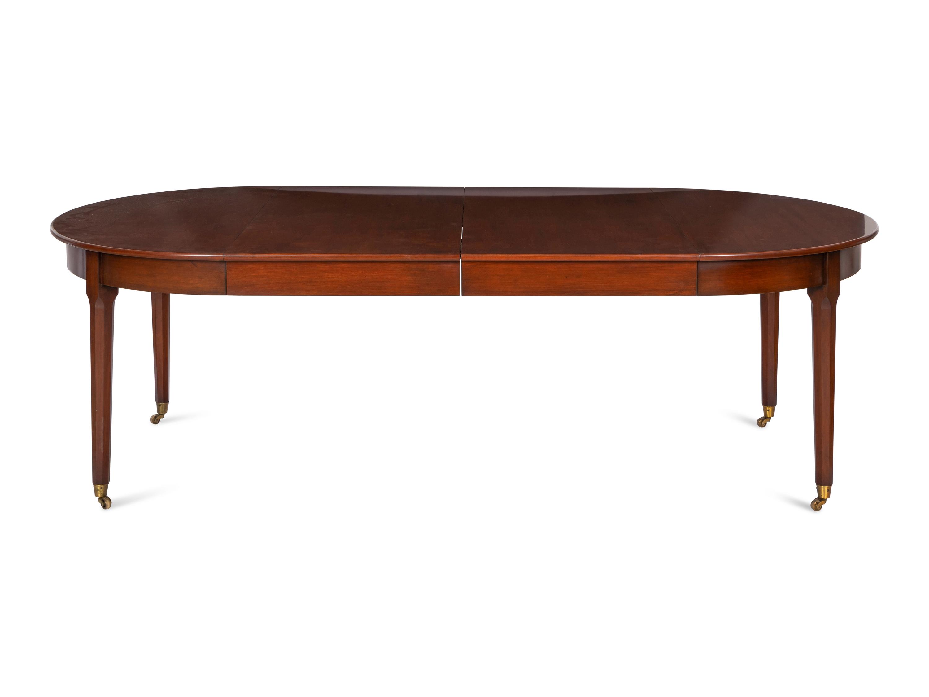 A Mahogany Dining Table and An Associated Set of Eight Mahogany Chairs