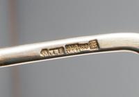 A Russian Silver-Gilt and Enamel Spoon, Mark of Ashmarin Mateevich, assay mark of Anatoly Artsybashev, Moscow, 1894, having an enamel f