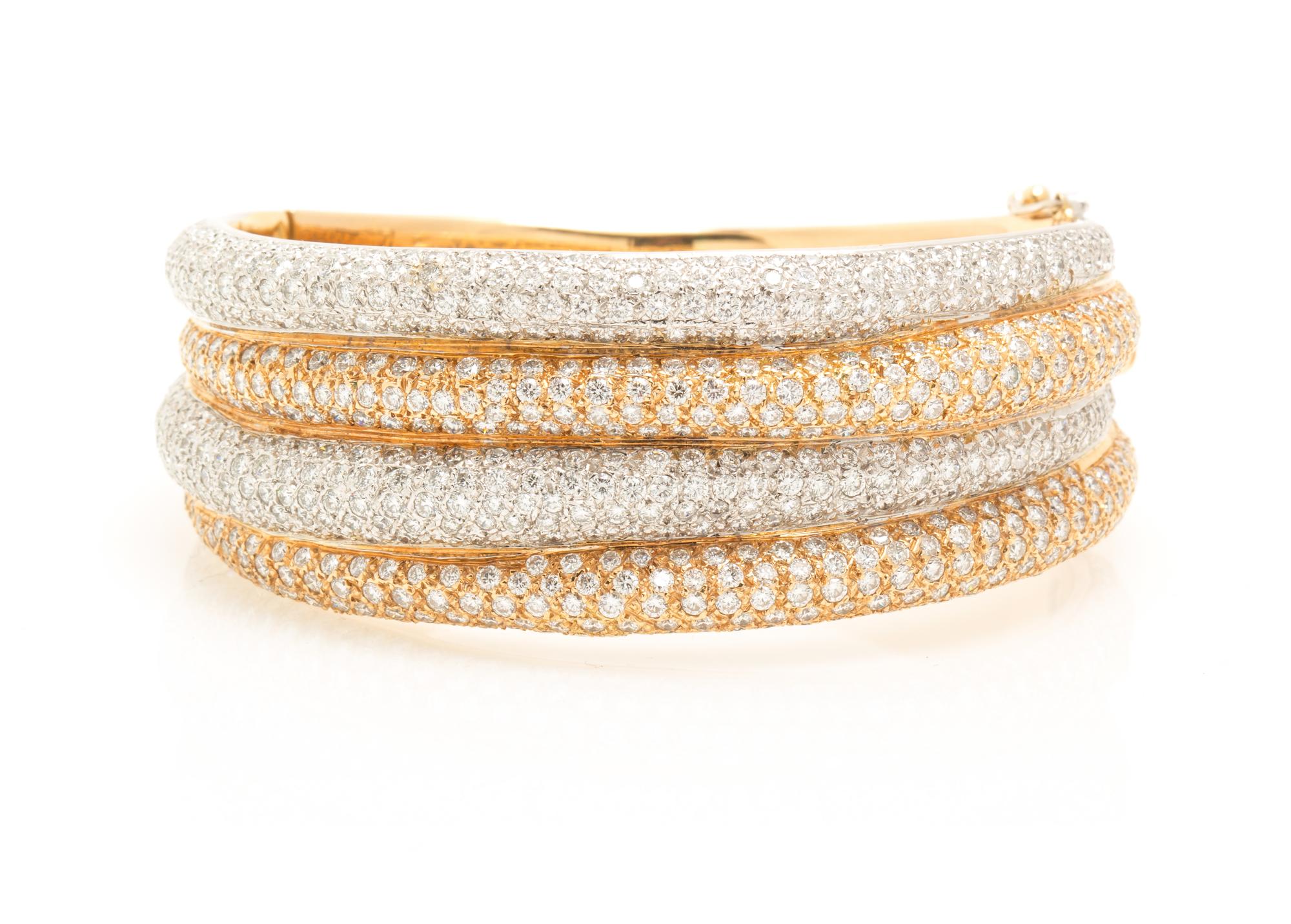A Two Tone Gold and Diamond Bangle Bracelet, 53.00 dwts.