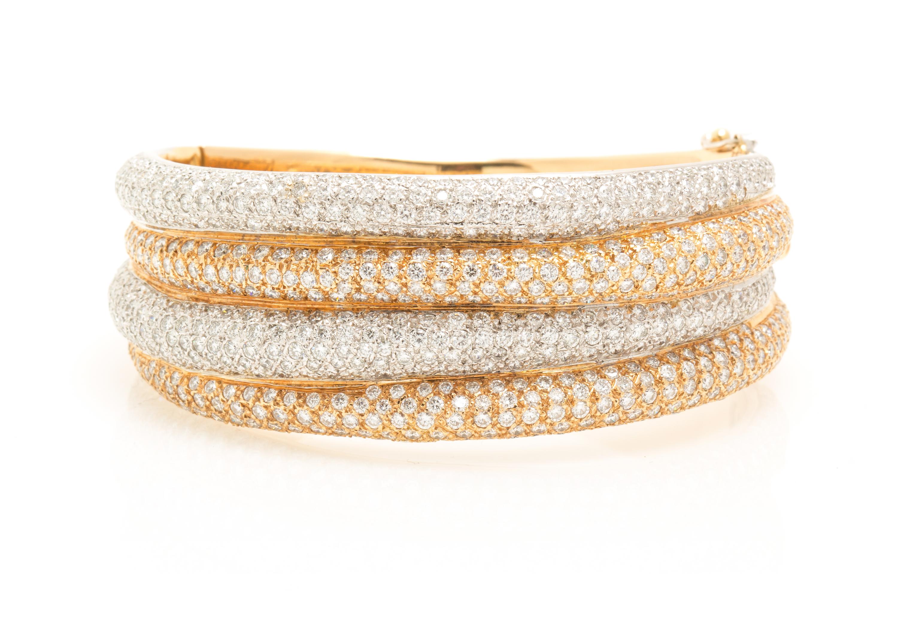 A Two Tone Gold and Diamond Bangle Bracelet, 53.00 dwts.