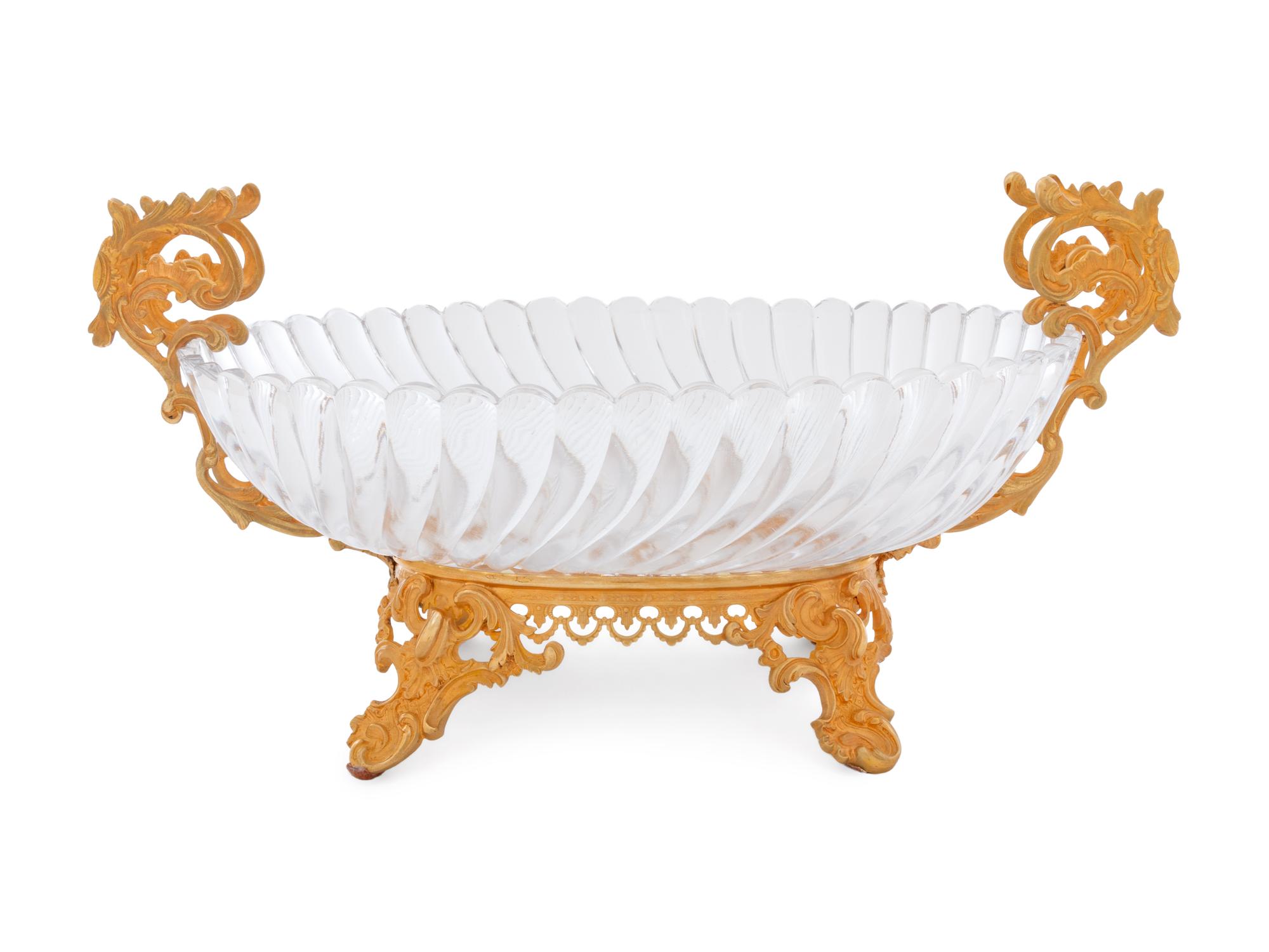 A Louis XV Style Gilt Bronze and Glass Table Garniture