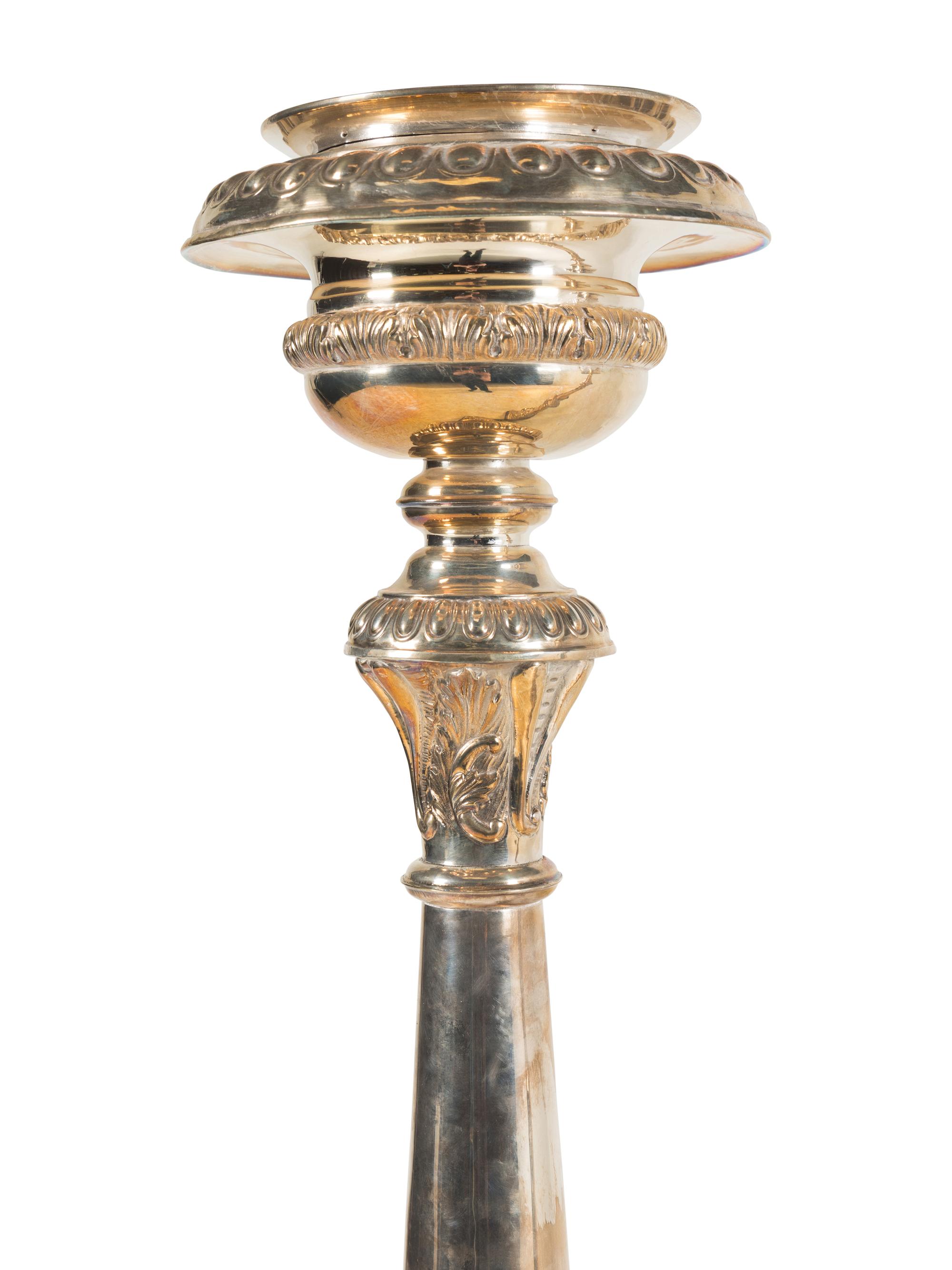 A Pair of Monumental Silvered Metal Altar Sticks
