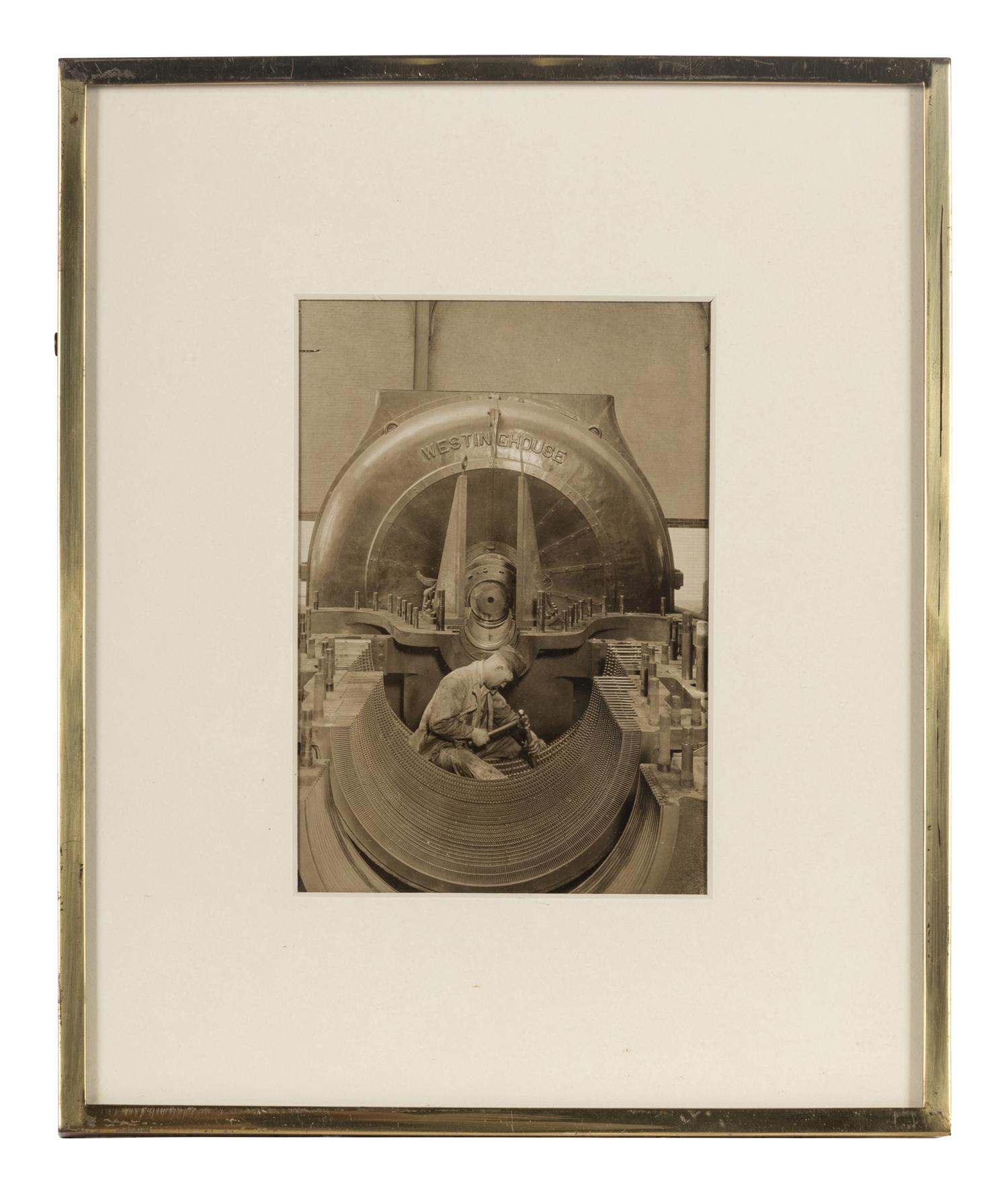 Lewis Hine (1874-1940) The heart of the turbine: Repairing turbine in power house, 1930
