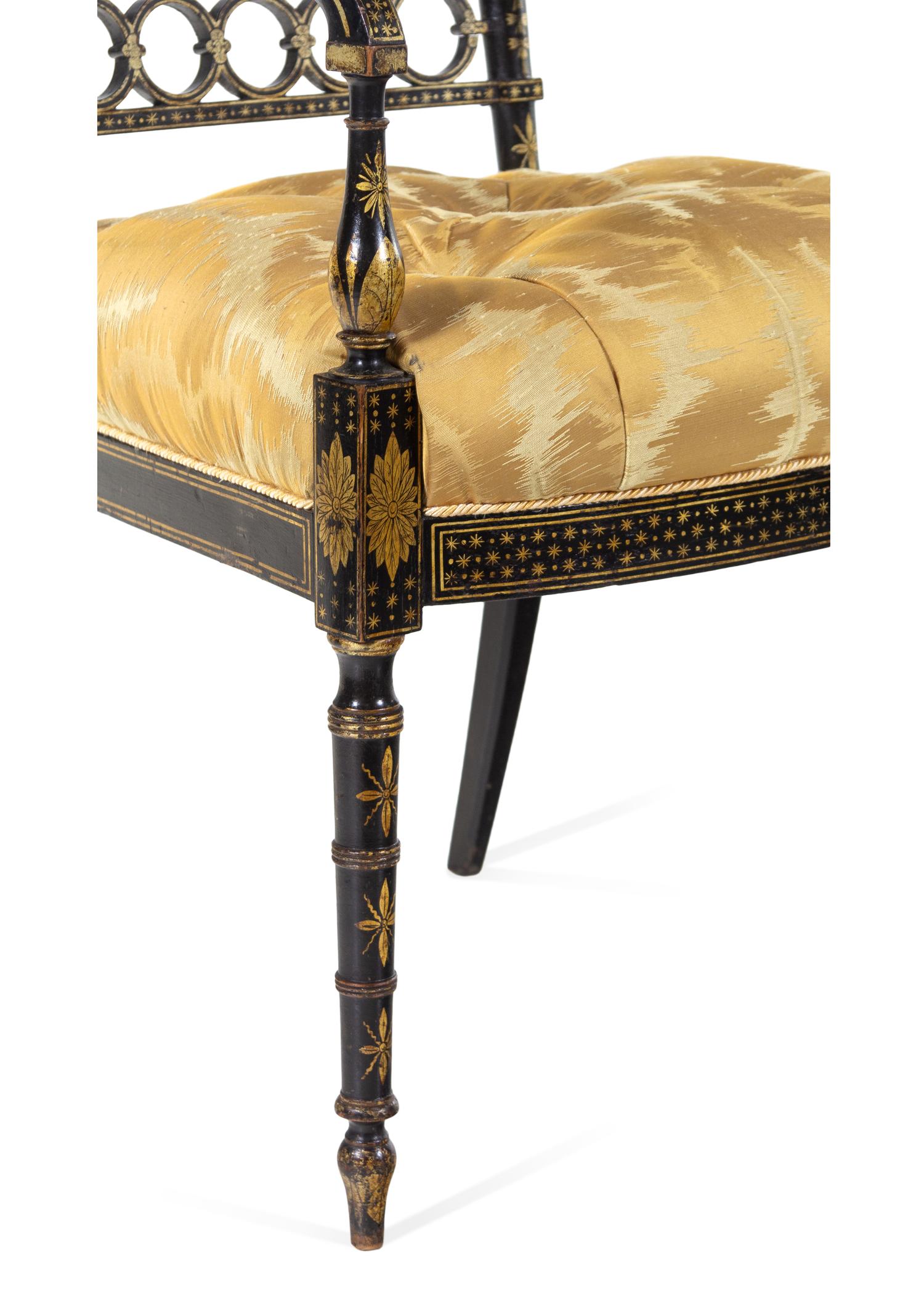 A Pair of Regency Style Gilt and Black Lacquered Armchairs