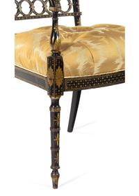 A Pair of Regency Style Gilt and Black Lacquered Armchairs