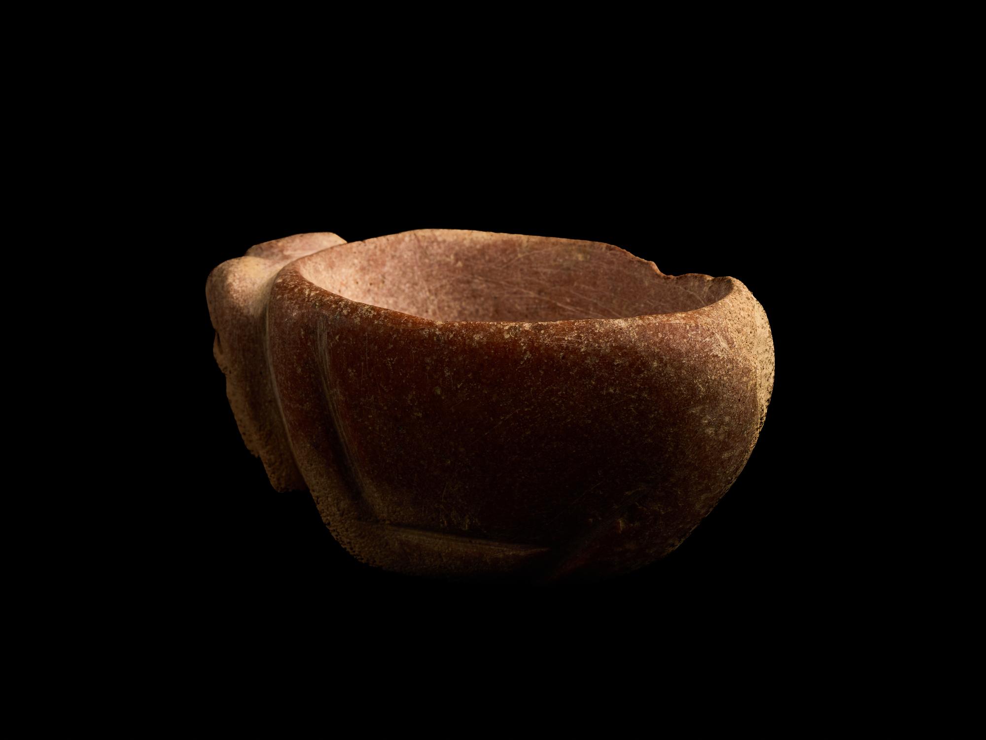 A Mesopotamian Red Marble Bowl in the Form of a Ram