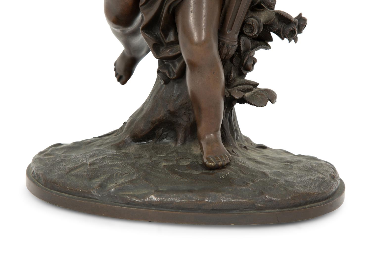 A French Bronze Figure of Eros on a Wood Base