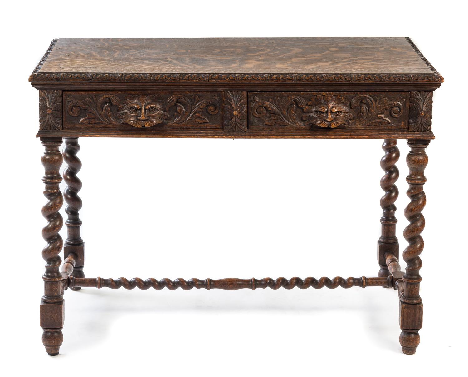 A Renaissance Revival Carved Oak Library Table Height 30 1/2 x width 42 x depth 26 3/4 inches. — LATE 19TH/EARLY 20TH CENTURY