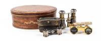 Two Pairs of French Opera Glasses and a Leather Clad Jewelry Casket Height of casket 5 inches. — 19TH CENTURY