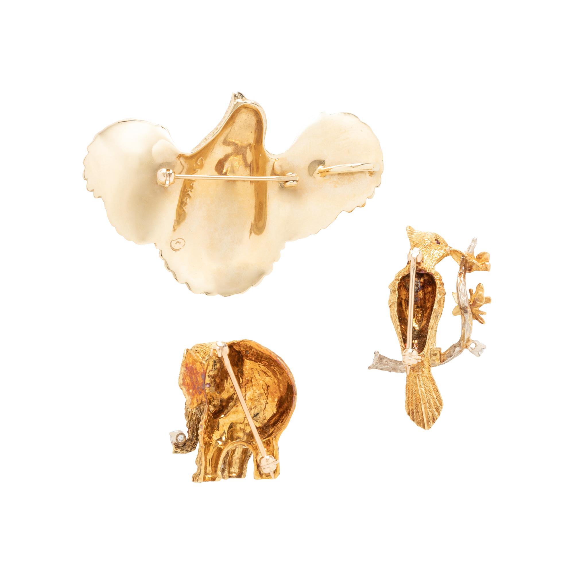 COLLECTION OF YELLOW GOLD BROOCHES