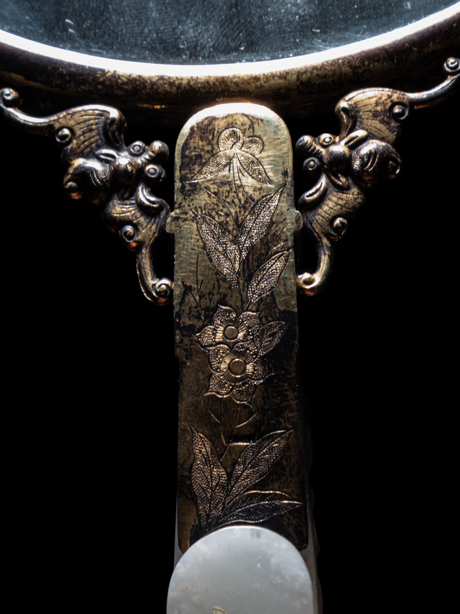 A White Jade Mounted and Hardstone Embellished Hand Mirror