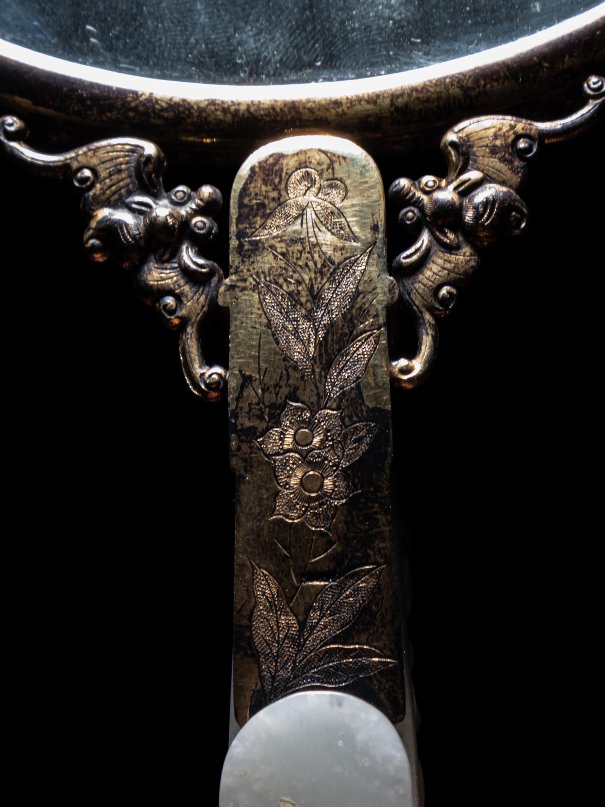 A White Jade Mounted and Hardstone Embellished Hand Mirror