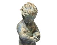 A cast zinc fountain head of a boy holding fish, 20th century