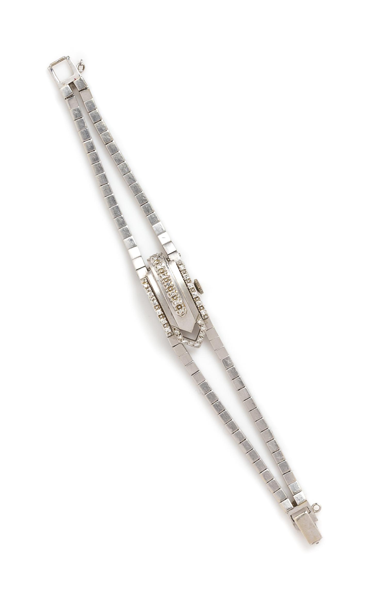 A Retro White Gold and Diamond Surprise Wristwatch, Circa 1953, 19.20 dwts.