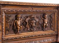 An Italian Renaissance Revival Carved Walnut Cassone on Stand