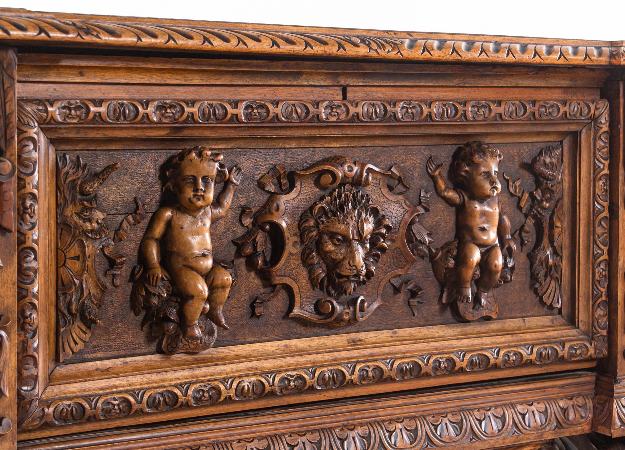 An Italian Renaissance Revival Carved Walnut Cassone on Stand