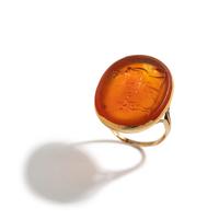A Neoclassical Gold and Carnelian Finger Ring with a Muse Playing a Harp