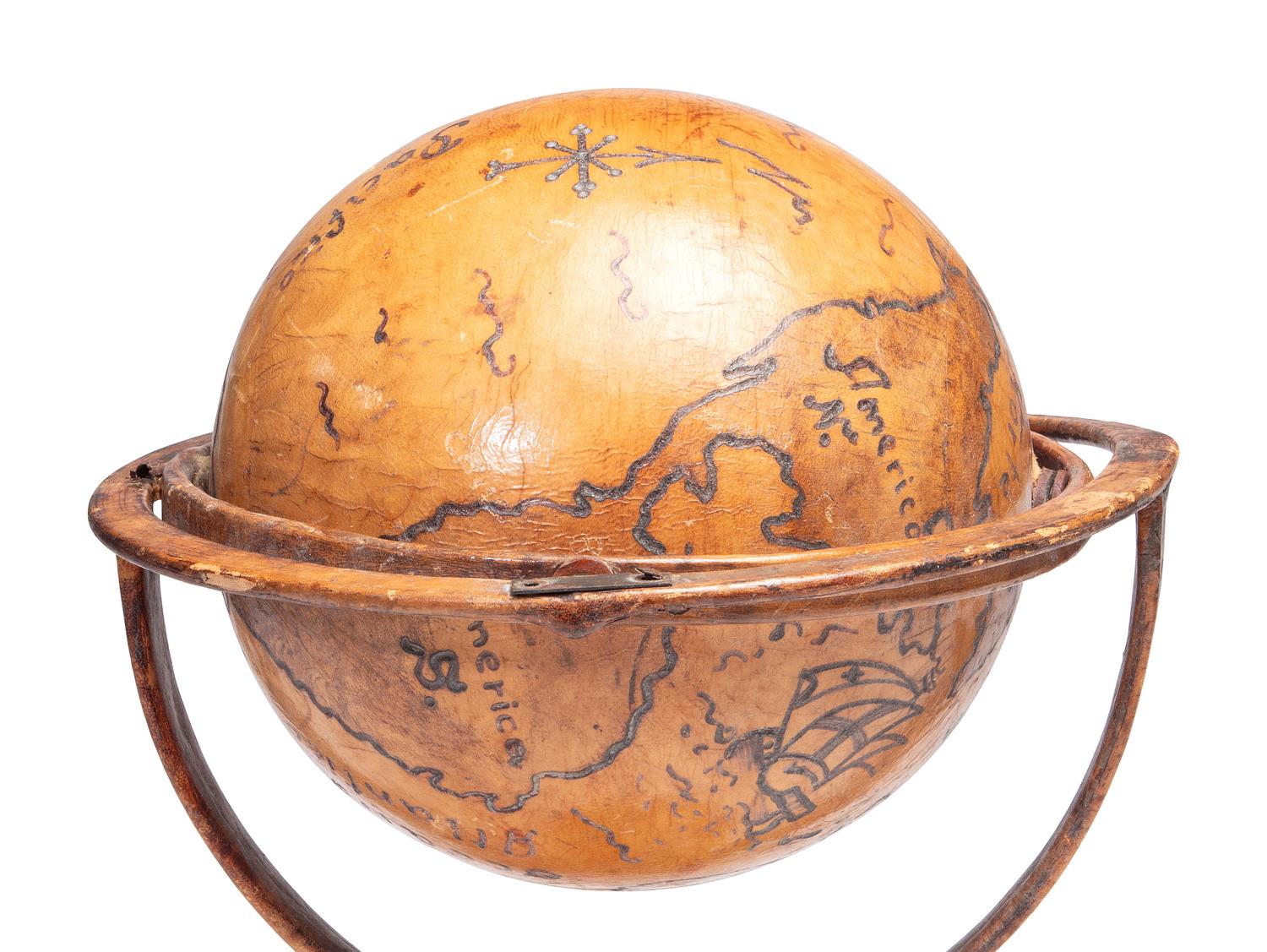 A Folk Art Painted Leather Covered Tabletop Globe