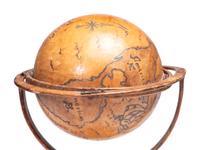 A Folk Art Painted Leather Covered Tabletop Globe