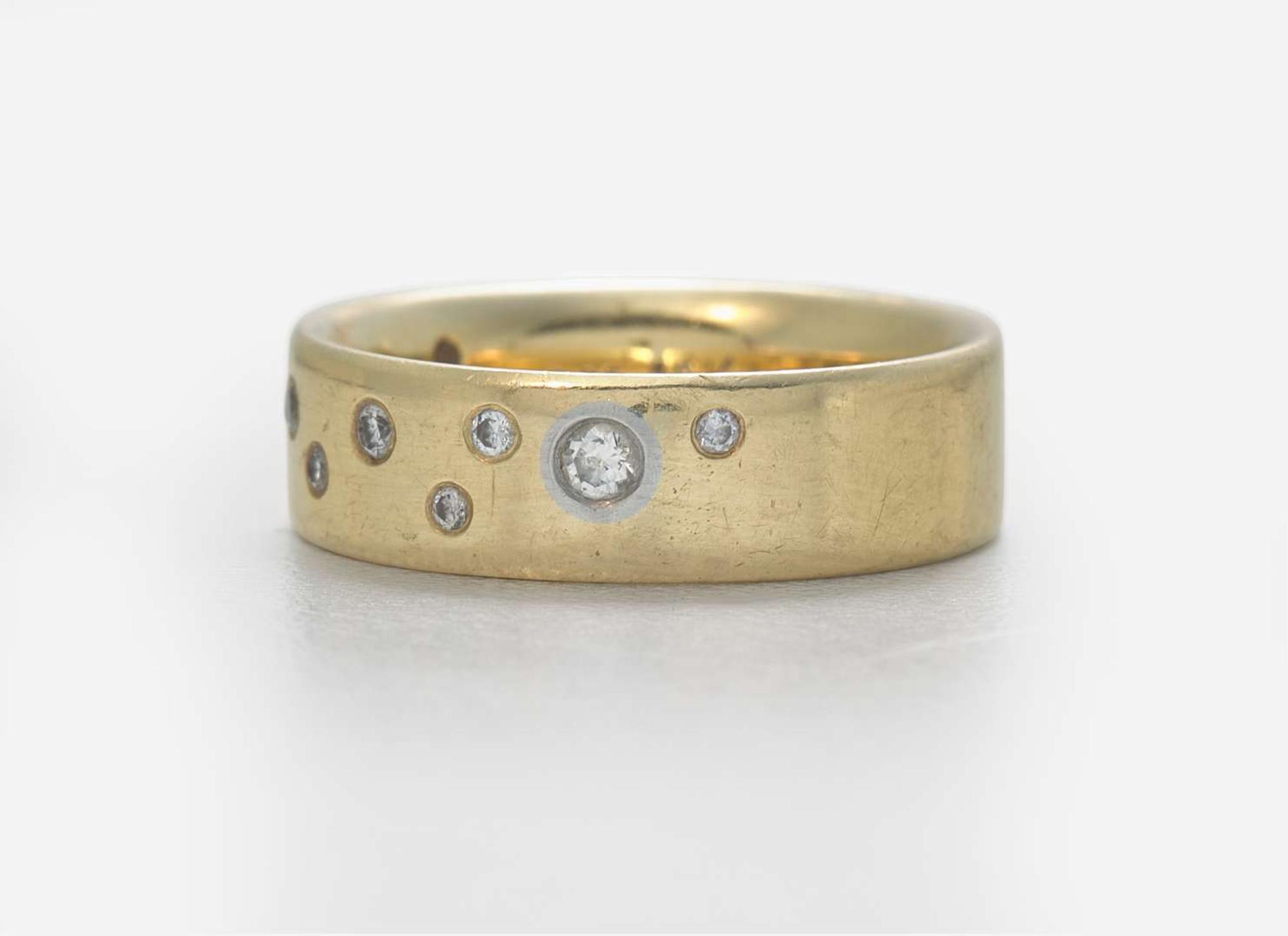 An 18K Yellow Gold Band with Accent Diamonds