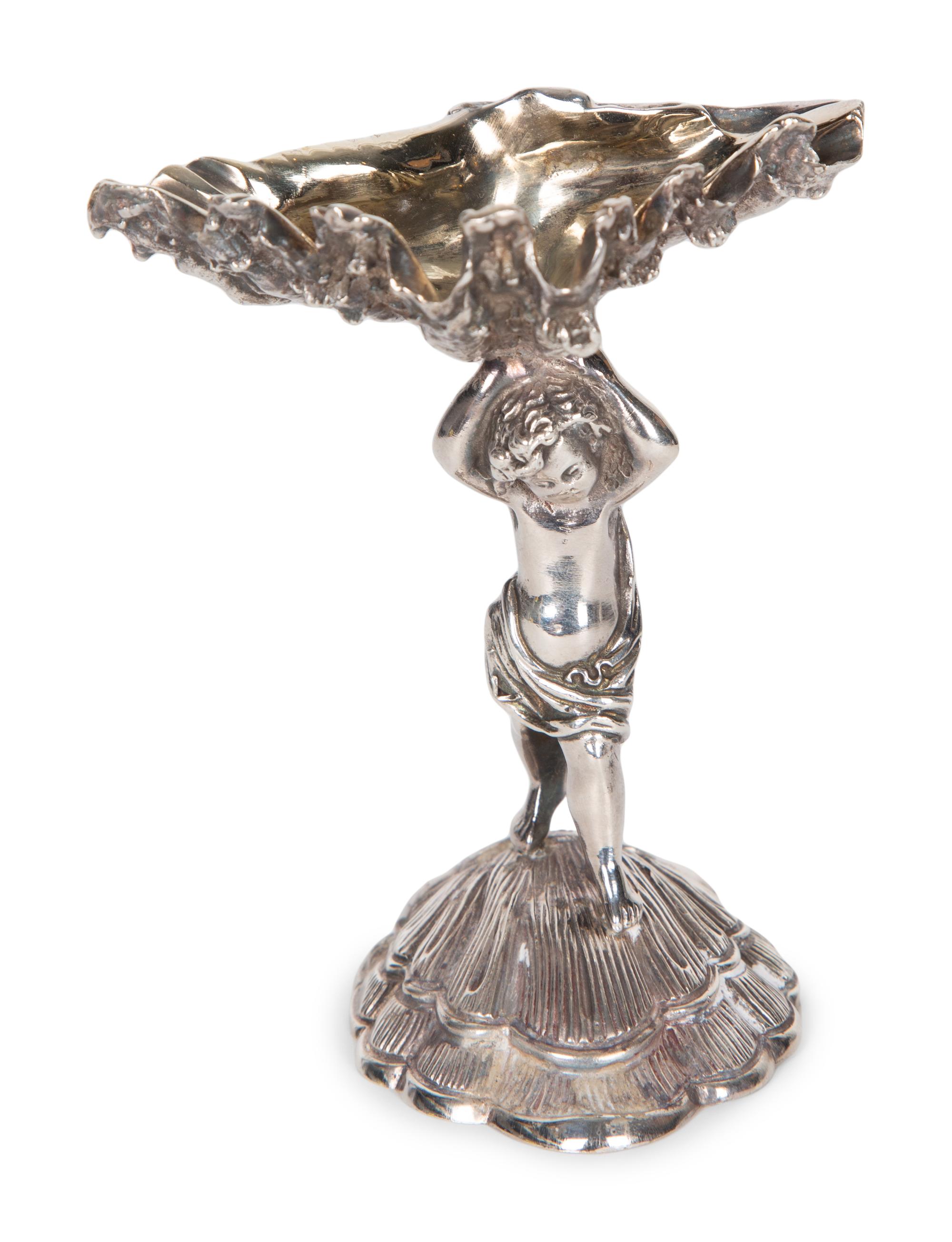 A Garrard & Co Silvered Figural Standing Salt and an Asprey Silver Bonnie Doon Commemorative Ashtray
