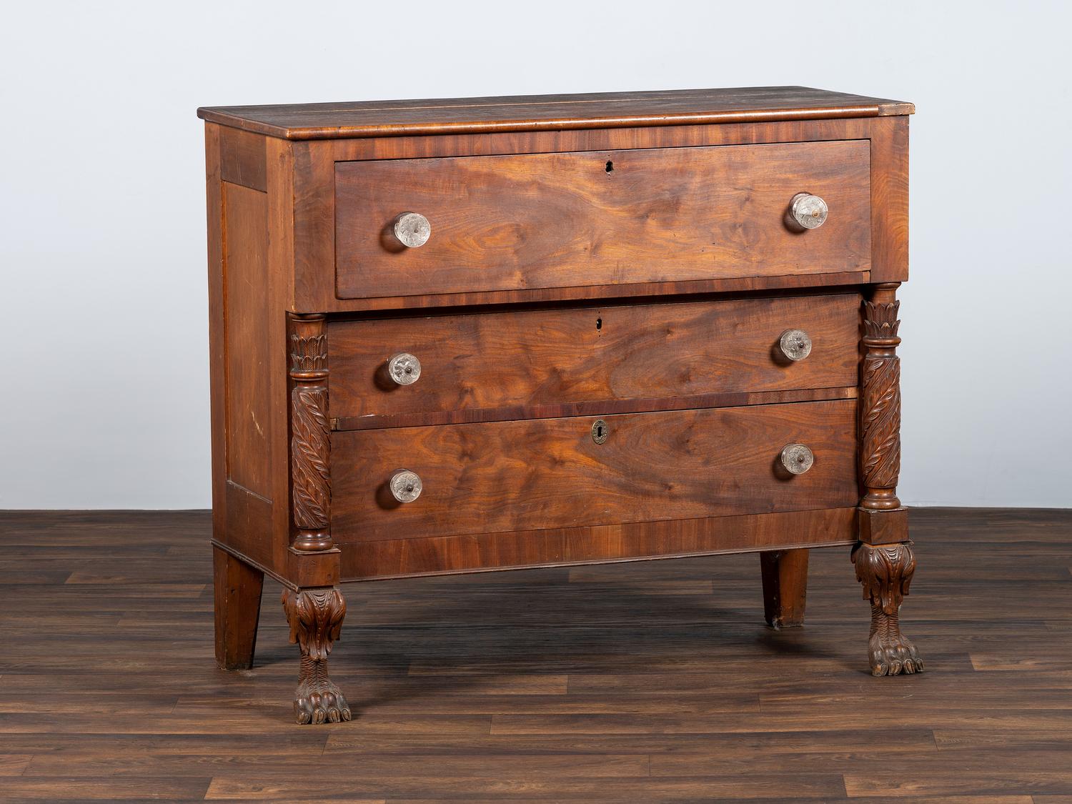 AWAITING DONATION - A Classical Carved Walnut-Veneered Chest of Drawers