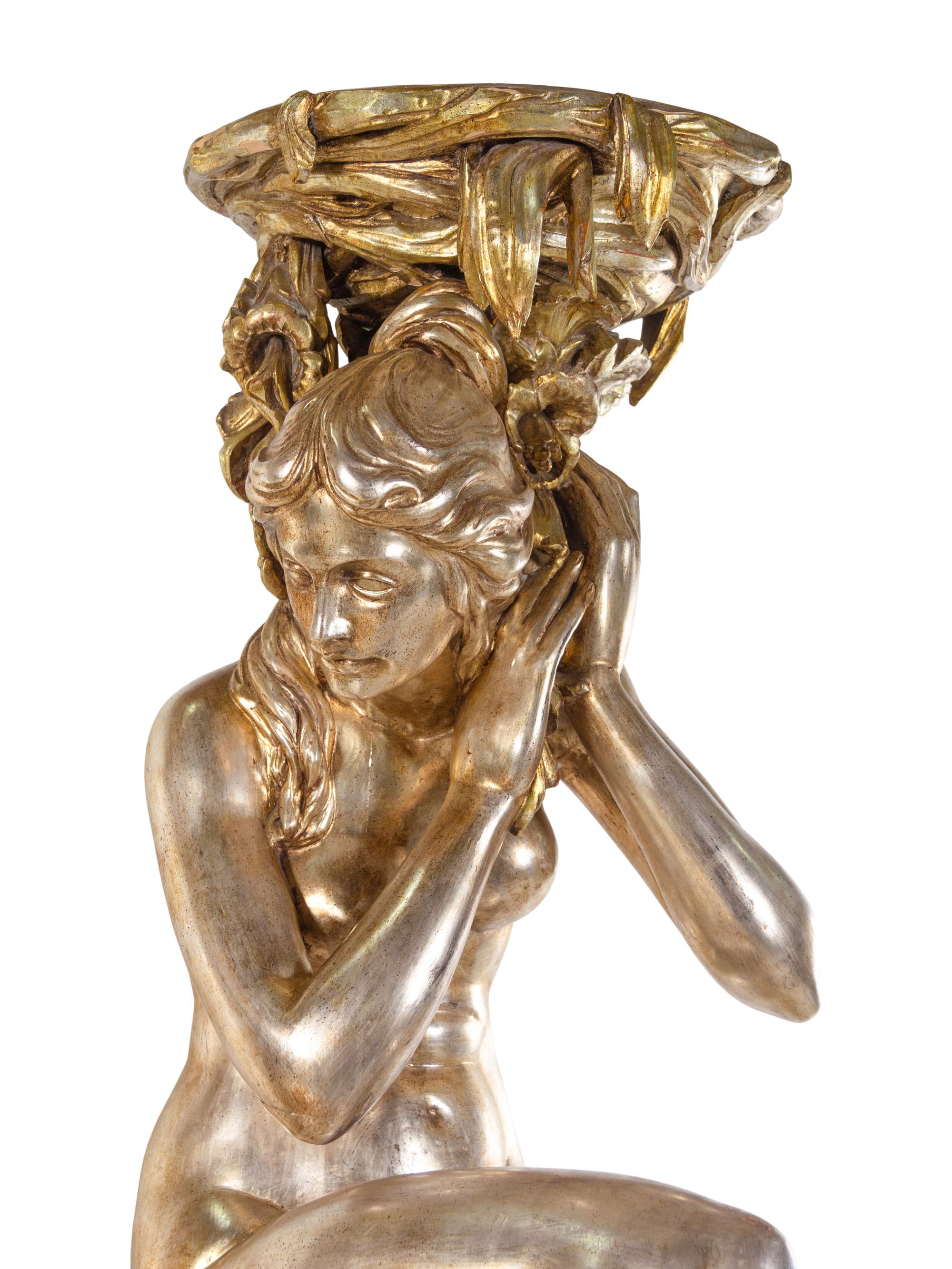 A Pair of Monumental Italian Baroque Style Gilt and Silvered Composition Figural Pedestals