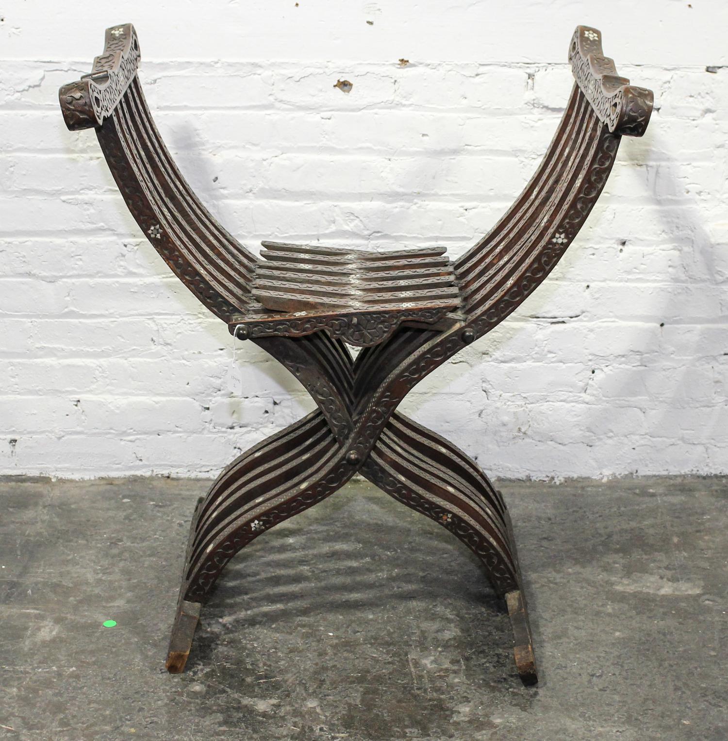 A Continental Mother-of-Pearl Inlaid Savonarola Chair. Height 31 1/2 inches.