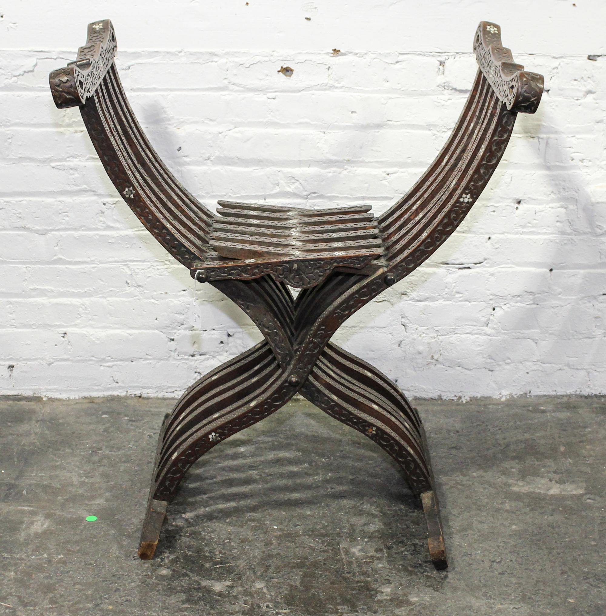 A Continental Mother-of-Pearl Inlaid Savonarola Chair. Height 31 1/2 inches.