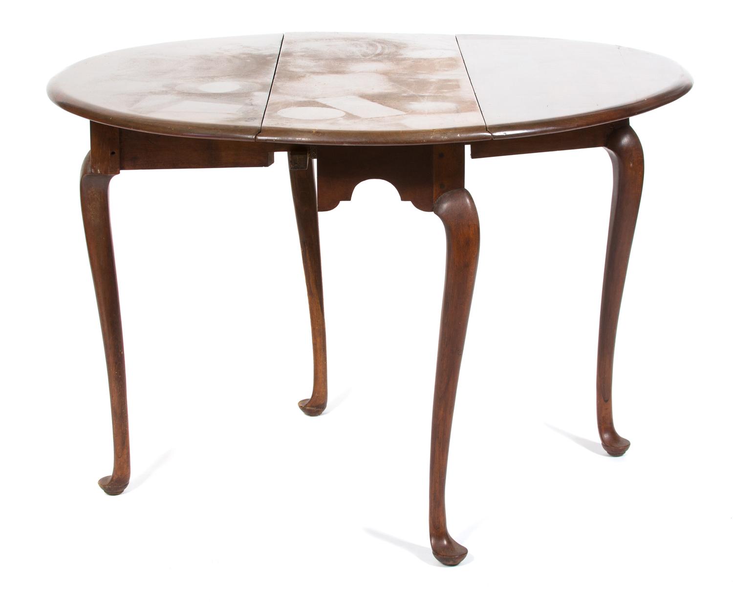 A Queen Anne Style Mahogany Oval Drop Leaf Table Height 27 3/4 x width 37 1/4 inches. — 20TH CENTURY