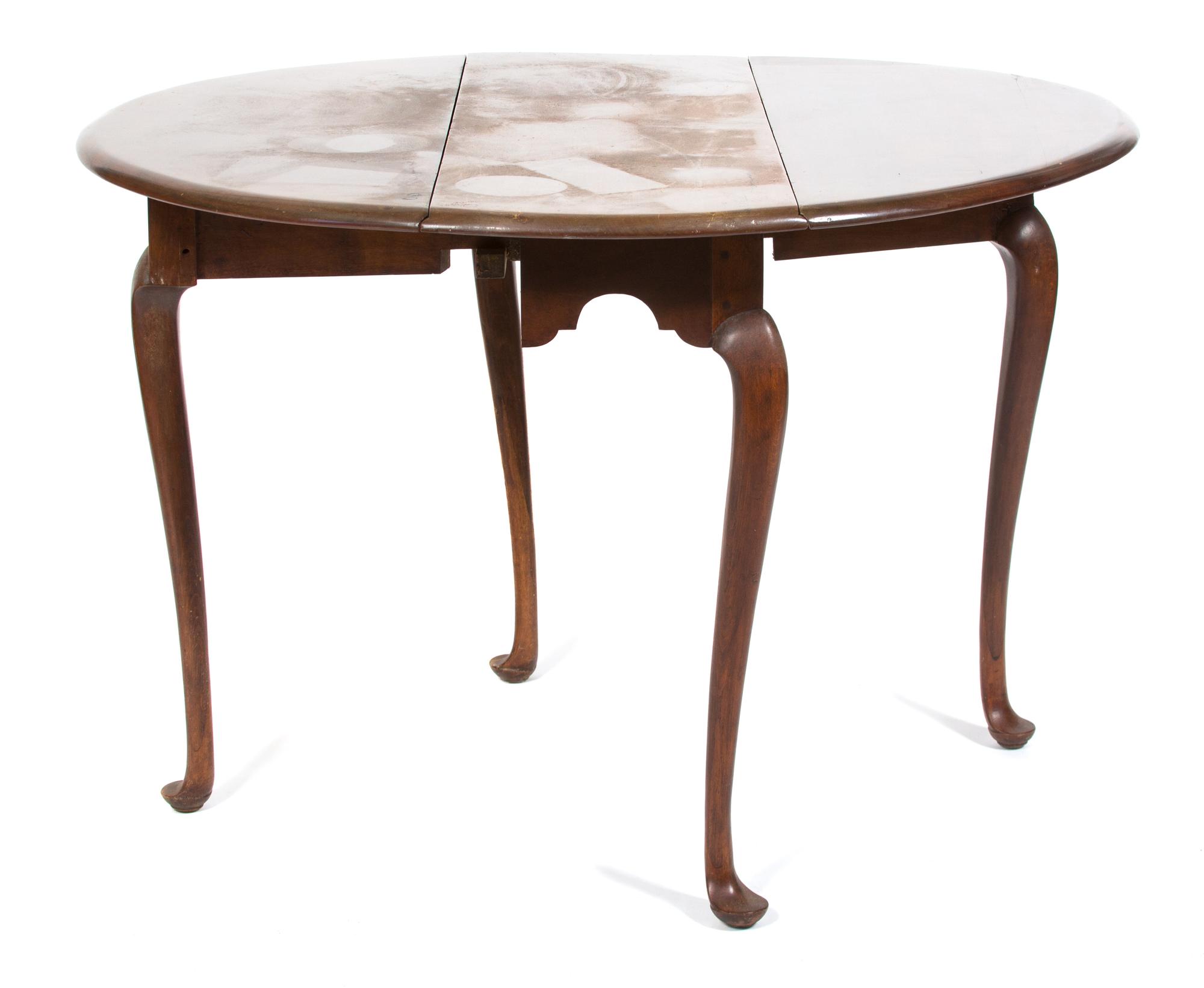 A Queen Anne Style Mahogany Oval Drop Leaf Table Height 27 3/4 x width 37 1/4 inches. — 20TH CENTURY