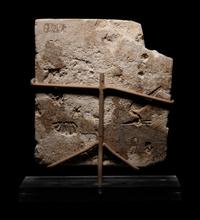 An Egyptian Limestone Sculptor's Model or Votive Relief