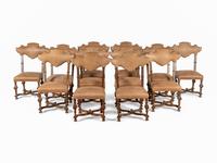 A Set of Twelve Spanish Baroque Style Dining Chairs