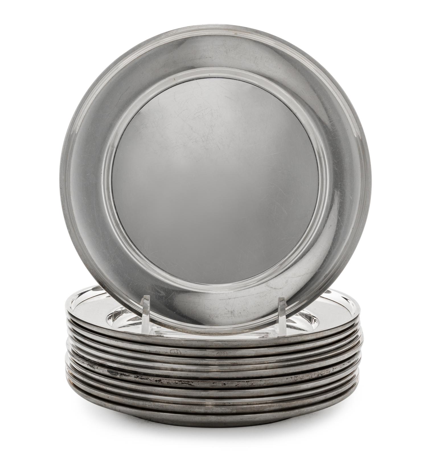 A Set of Eleven American Silver Bread Plates, Mid 20th Century, plain circular form with upturned rims.